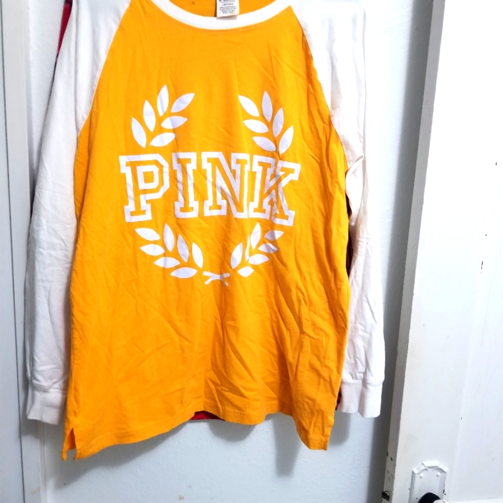 Pink long sleeved yellow Jersey. Sz large. NWOT. Excellent condition.